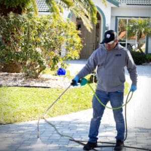 expert pressure washer cleaning sidewalk in residential area of rockledge fl