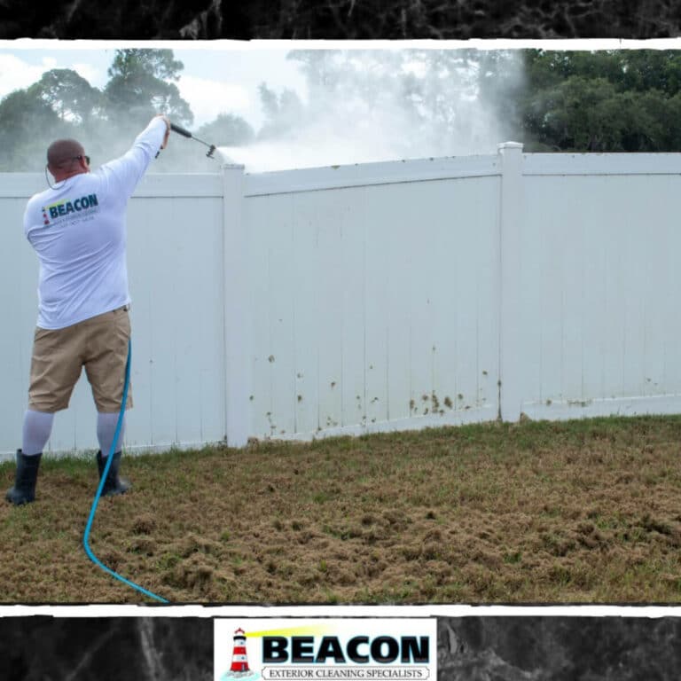 professional house washer cleaning wood fence in melbourne fl