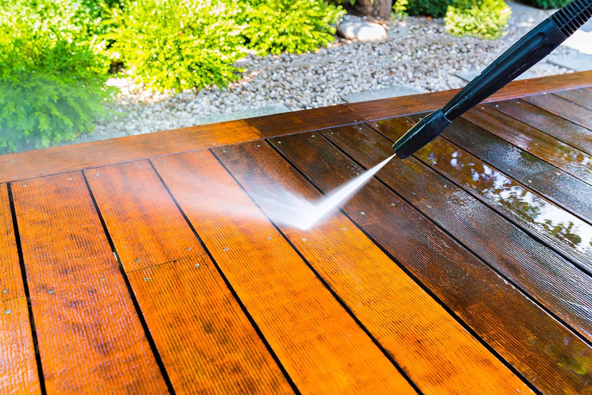 pressure washing a wooden deck